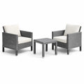 Ensemble de jardin en rotin synthétique gris avec coussins beiges - 2 fauteuils et table basse